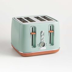 a blue toaster sitting on top of a white table