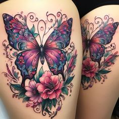 the back of a woman's thigh with colorful butterflies and flowers on her thighs