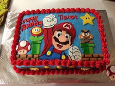 a birthday cake with mario and other characters on it