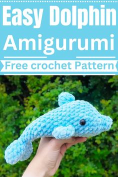 a hand holding a crocheted stuffed animal with the text easy dolphin amigurmi free crochet pattern