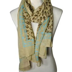 This designer inspired scarf lets you walk on the wild side yet has a soft girly side with the pastel edging. A twist on the traditional leopard print scarf, this scarf does not disappoint. Made with cotton, rayon, and lycra, this lightweight scarf is ideal for light and breezy weather. Available in colors pink or sky blue. Dimensions: 72"L x 42"W. Material: Cotton, Rayon, Lycra. Trendy Beige Scarves For Spring, Traditional Leopard, Fashion Apron, Earring Jewelry Box, Lace Tape, Towel Crafts, Pencil Case Stationery, Walk On The Wild Side, Baby Hair Accessories