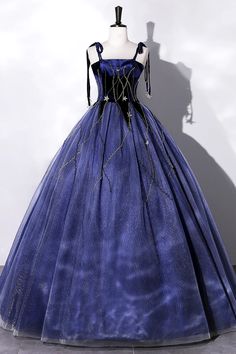 Evoke the magic of a starlit night with this captivating midnight blue velvet gown. The luxurious fabric is tailored to perfection, featuring a fitted bodice that gracefully flows into a full, floor-length skirt. Golden thread embellishments meander across the gown like constellations, catching the light and ensuring youre the center of attention.The gowns square neckline and delicate spaghetti straps highlight the shoulders and create an elegant frame for statement jewelry. Its cinched waist is Blue Velvet Gown, Tulle Long Prom Dress, Blue Party Dress, Velvet Gown, Star Blue, Wholesale Dress, Evening Party Dress, Long Prom Dress, Evening Party