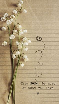 a bunch of flowers sitting on top of a piece of lined paper