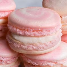 pink and white macaroons stacked on top of each other