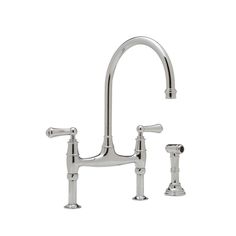 a kitchen faucet with two handles and nozzles