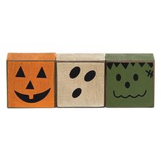 three wooden blocks decorated with halloween faces and jack - o'- lantern faces on them