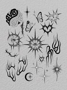 an assortment of tattoo designs on paper