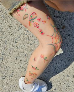 a person with tattoos on their legs and feet