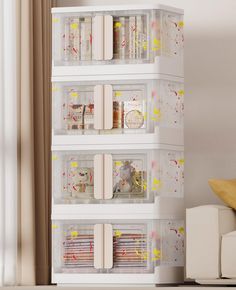 three clear shelves filled with different types of crafting supplies