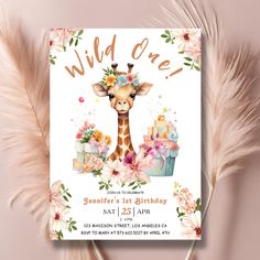 a birthday card with a giraffe surrounded by flowers and cake on it's front