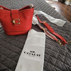 Brand New With Tag Paid $275+Tax For It.Has 2 Stripes.The Color Is Coral It's Good For Fall And Summe, It Comes With Dust Bag As Well. Designer Bucket Bag With Detachable Strap For Errands, Coach Bucket Shoulder Bag With Branded Hardware, Designer Satchel Bucket Bag With Branded Hardware, Luxury Coach Bucket Bag With Detachable Strap, Luxury Coach Bucket Bag With Detachable Handle, Designer Satchel Bucket Bag, Designer Coach Bucket Shoulder Bag, Designer Bucket Bag With Branded Hardware, Coach Luxury Bucket Bag For Errands