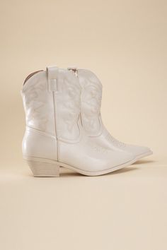 A stylish and versatile pair of boots that bring a touch of Western charm to your footwear collection. These boots feature a tapered toe and a block heel, combining classic elements with modern comfort. Toe: Tapered toe Heel shape: Block heel Material: Synthetic Imported Heel Height: 1.5” Care Instructions: Use a soft cloth and a little lukewarm water to clean the footwear after use. If necessary, add a small amount of mild soap.Carefully wipe off soap residue with a damp cloth. Modern Cowgirl, China Style, Zipper Heels, Western Booties, Studded Boots, Footwear Collection, Fairy Grunge, Grunge Style, Bright Stars