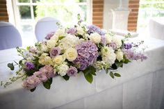 a bouquet of flowers sitting on top of a table