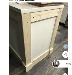 a kitchen island made out of plywood and some white paint on the counter top