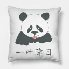 a pillow with a panda face on it