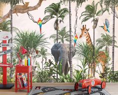 an elephant and giraffe mural in a children's room with toys on the floor