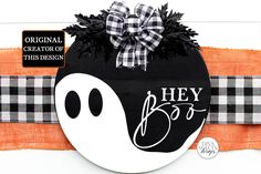 a black and white sign with a ghost on it that says hey booy in the center