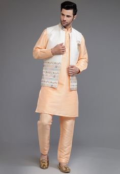 Art Silk Kurta and Pant in Peach Color. Available with an Art Silk Nehru Jacket in Off White Color. This Chinese Collar Neck and Half Sleeve Ready-made attire is Enhanced with Buttons, Mirror Effect and Resham Work.   Do note: Dupatta, Brooch and Footwear shown in the image is for presentation purposes only. Half to one inch may vary in measurement. (Slight variation in actual color vs. image is possible) We Sell all kinds of Menswear. Mens Kurta | Mens Kurta & Pant | Traditional Menswear | Part Pink Nehru Jacket With Zari Work For Spring, Spring Pink Nehru Jacket With Zari Work, Pink Embroidered Nehru Jacket Kurta, Festive Pink Chanderi Nehru Jacket, Traditional Orange Sets For Spring, Traditional Sherwani With Pallu For Spring, Peach Kurta With Zari Work And Long Sleeves, Peach Kurta With Zari Work, Traditional Peach Kurta With Traditional Drape