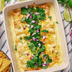 an enchilada dish with cilantro and onions