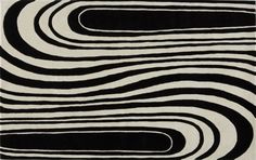 a black and white rug with wavy lines