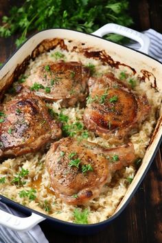 some meat and rice in a pan on a table