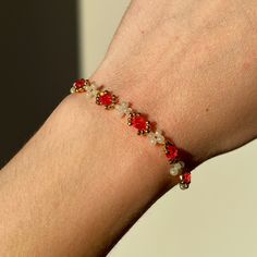 This dainty floral bracelet is handmade with individual seed beads, incorporating gold, white, and a striking red to create a beautiful alternating daisy pattern. It is simple yet elegant, incorporating several floral elements and gems, alternating in intricacy and style. This bracelet is sure to stand out without being bulky or overly dramatic. ੈ♡˳ Handmade with love and attention ੈ♡˳ Delicate selection of beads and charms, carefully and individually handpicked ੈ♡˳ Makes a perfect gift for frie Cheap Red Beaded Bracelets With Gold Beads, Gold Flower Bracelet, Bracelets Red, Red Beaded Bracelet, Bracelets Design, Fairy Jewelry, Floral Bracelet, Beads Bracelet Design, Red Bracelets