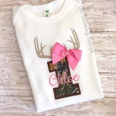 Deer Antler Birthday Shirt **Price includes only the shirt** -Applique design -True to Size -Customizable name and age  FABRIC/RIBBON PATTERNS & COLORS: Due to seasonal availability of fabrics and ribbon, patterns/colors may vary from the listing photo, but will not take away from the overall theme or appearance of the design. If this is a concern, please contact me prior to ordering. Deer First Birthday, Camo Tutu, Girl Hunting, Fabric Tutu, Pink Mossy Oak, First Birthday Shirt, Under Armour Sweatshirts, Camo Purse, First Birthday Shirts