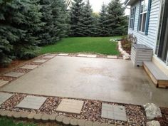 a patio with flags and stepping stones around it