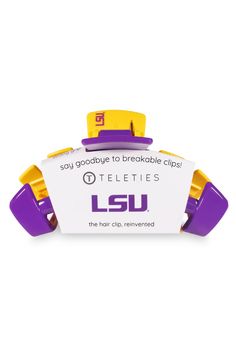 a purple and yellow object with the word lsu on it's front end, sitting in