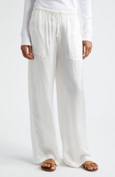 If you must step away from your pool chaise or beach towel, pop on some cotton pants closed with a comfy drawstring. Drawstring waist Front patch pockets 100% cotton Machine wash, line dry Imported White Bottoms With Drawstring And Loosely Fitted Hips, White Drawstring Bottoms Loosely Fitted Hips, White Bottoms With Drawstring And Long Pants, White Drawstring Long Pants, White Vacation Bottoms With Side Pockets, White Linen Lounging Bottoms, Relaxed Fit Off White Bottoms For Loungewear, White Bottoms For Summer Lounging, White Summer Lounging Bottoms