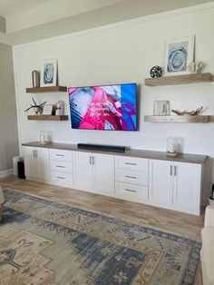 a flat screen tv mounted to the side of a wall