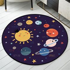 an area rug with various planets and stars on it in a room next to a bathtub