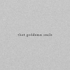 the words that godalam smile are written in black on a gray paper background