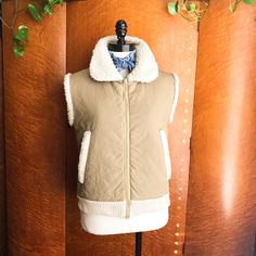 ~Follow Chickaboomvintage Here & On Instagram~ Betmar Of New York 1970’s Vintage Khaki Quilted Sherpa Ribbed Utility Workwear Vest- Size M Absolutely Gorgeous, Vintage 70’s, Faux Sheepskin & Khaki, Zig-Zag Quilted Workwear Vest Has Thick, Cream-Colored Ribbing At The Hemline. Talon Zipper, Slash Pockets, Rounded Snub Collar. Warm, Snuggly & Perfect Over Vintage Denim Or Bells. Perfect Over Turtlenecks, Tees & Plaids. Excellent Condition. Measurements- B-38 L-22 W-36 Shoulders-17 Hem-32 Retro Beige Patchwork Outerwear, Beige Retro Patchwork Outerwear, Retro Winter Outerwear For Layering, Retro Winter Layering Outerwear, Vintage Outerwear For Fall Layering, Retro Khaki Outerwear For Fall, Retro Khaki Outerwear For Spring, Vintage Cotton Outerwear For Layering, Vintage Brown Outerwear For Layering