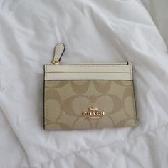 Brand New Coach Beige Bag With Interior Card Slots, Cream Coin Purse For Daily Use, Gold Coin Purse For Everyday Use, Beige Wallet With Gold-tone Hardware For Everyday, Elegant Coach Beige Coin Purse, Elegant Beige Coin Purse With Interior Card Slots, Elegant Beige Coin Purse With Zipper Closure, Elegant Beige Coin Purse With Zipper, Chic Beige Rectangular Coin Purse