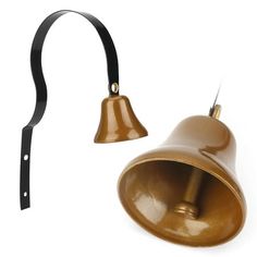 an old brass bell with a black handle