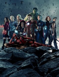 a group of avengers standing on top of a mountain