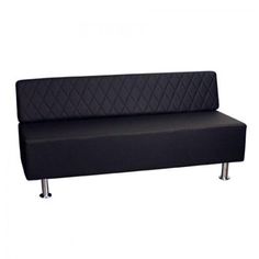 a black couch sitting on top of a metal frame