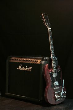 a guitar and amp sitting on top of a table