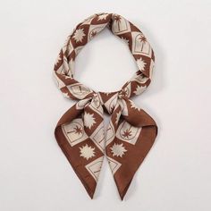 This versatile bandana scarf is a must-have accessory for women, offering endless styling options. Measuring 70x70cm, it can be used as a waistband, bag ornament, hair band, headband, or fashionable scarf. With a new spring style and simple print, it adds a touch of fashion to any outfit. Color : Coffee Brown Material : Polyester Composition : 100% Polyester Element : Plants Product Technique : Printing Length Width 27.6 27.6 Printed Bandana, Printed Silk Scarf, Bandana Scarf, Color Coffee, Bandana Print, Simple Prints, Coffee Brown, Spring Style, Square Scarf