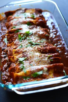 a casserole dish filled with meat and cheese