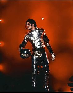 a man dressed as michael jackson on stage