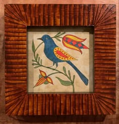 a wooden frame with a bird painted on it