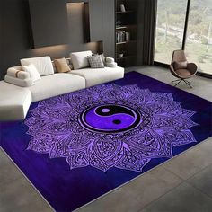 a living room area rug with a purple and black yin - yang symbol on it