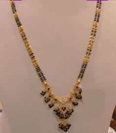 #blackbeads #short #916gold #nallapusalu #fashion #Latestdesign #gold #kdm #mangalsutracollection  #mangalsutra Long Black Beads Mangalsutra Designs Gold, Long Black Beads Mangalsutra Designs, Nallapusalu Designs Gold Long, Gold Earrings With Price, Tanishq Jewellery, Simple Necklace Designs