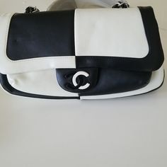 Chanel Vintage Preowned In Excellent Condition Black And White Leather Color Block Bag This Is A Rare Chanel Bag With The Front Cc Logo In Hard Black And White Plastic Black And White Together Are Timeless And Always In Style.This Is A Beautiful Chanel Bag .It Is Timeless In Style. Height 5.2"X 2.5 Widthx,10.5 " Length Place Of Origin France Color Block Bag, Chanel Vintage, Cc Logo, Vintage Chanel, Chanel Handbags, Chanel Bag, White Leather, Color Block, Chanel