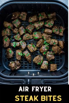 an air fryer filled with steak bites and green sprinkles