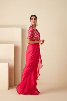 This ensemble features an overlap blouse adorned with intricate handwork details, exuding elegance with every stitch. Paired with a pre-draped ruffle saree crafted from luxurious georgette crepe and soft organza, it offers a seamless fusion of comfort and style. The blouse boasts an overlap opening with a tie-up for customizable comfort, while both pieces are padded and fully lined for a flawless fit. Elevate your ethnic wardrobe with this exquisite ensemble, perfect for special occasions and ce Western Gown, Indo Western Gown, Ruffle Saree, Set Saree, Saree For Women, Drape Saree, Sharara Set, Anarkali Suit, Pink Ruffle