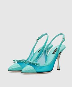 These Dolce & Gabbana mesh slingback pumps reek of elegance. Don't let their classic shape fool you, as the blue leather, mesh panelling, and slim bows add a glamorous, feminine touch. Perfect for strutting your stuff with a pointed toe, contrasting toe cap, slingback ankle strap, and sky-high stiletto heel. Finished with a leather sole. Model: Slingback heels Color: Light Blue Material: 60% PA+40% Calf Leather Buckle closure Leather bottom sole Made in Italy Luxury Formal Slingback Pumps With Bow Straps, Luxury Slingback Pumps With Bow Straps For Evening, Luxury Evening Slingback Pumps With Bow Straps, Luxury Mesh Heels For Formal Occasions, Luxury Blue Slingback Pumps For Party, Designer Blue Slingback Pumps For Evening, Evening Mesh Slingback Pumps With Pointed Toe, Formal Mesh Slingback Pumps With Pointed Toe, Chic Mesh Slingback Pumps For Formal Occasions