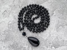 Black Necklace, Black Agate Long Necklace, 108 Mala Bead Necklace, Gift  for Man for Women, Hand Knotted Black Onyx Drop Pendant Necklace -  8mm Black Agate 108 beads -  10mm Black Onyx Guru bead -  Black Agate Pendant The necklace you see in the photo are made from 108 beads, each with a diameter of 8mm, creating a beautifully crafted piece. The length of the necklace is approximately 40 inches plus 4cm pendant.  Since I custom-make these necklaces, I can make them any length but also make alte Spiritual Black Crystal Necklaces With Faceted Beads, Black Spiritual Crystal Necklace With Faceted Beads, Spiritual Black Crystal Necklace With Faceted Beads, Black Necklaces With Natural Stones For Meditation, Spiritual Black Onyx Necklaces, Spiritual Black Onyx Necklace, Onyx Necklace With Black Beads For Meditation, Black Onyx Crystal Necklace With Black Beads, Black Onyx Beaded Necklace With Faceted Beads